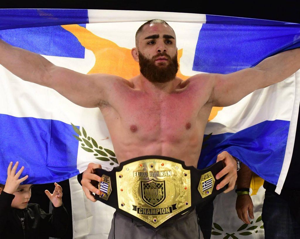 Andreas Tricomitis celebrates winning the EuroBalkan MMA Title at MCP 9 in 2019