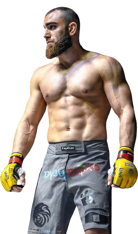 Andreas Tricomitis standing in the cage before a professional MMA bout