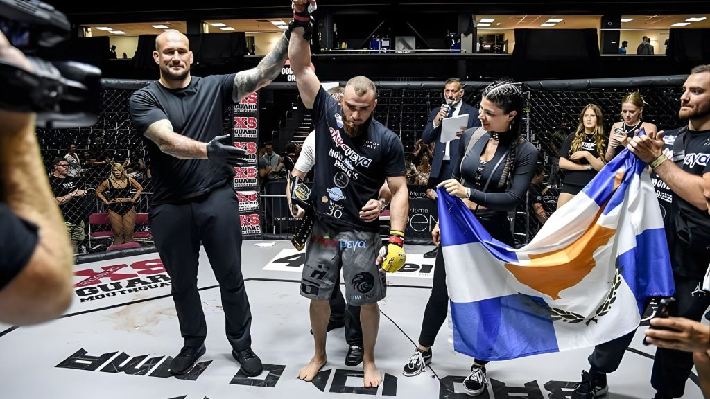 Crowd reacts to Andreas Tricomitis winning the BMF MMA World Title in England