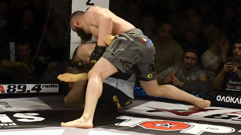 Oganesyan Threatens Trikomitis